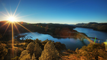 Картинка природа восходы закаты река солнце мост небо холмы лучи