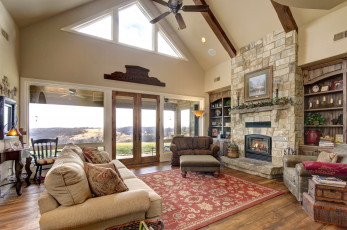 Картинка интерьер гостиная картина ковер диваны камин