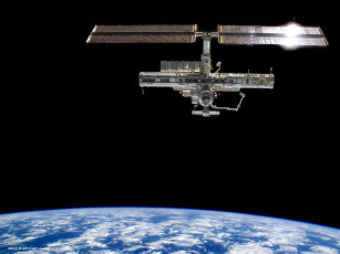 Картинка the iss in orbit around earth космос космические корабли станции