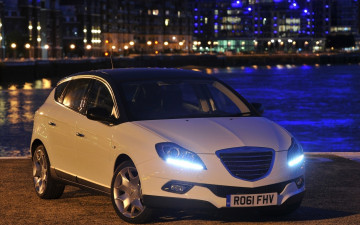 Картинка lancia автомобили город река набережная белая