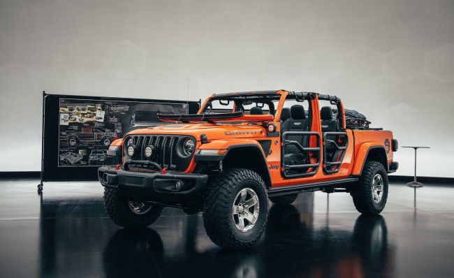Обои картинки фото автомобили, jeep, gladiator, gravity, джип, стенд, оранжевый