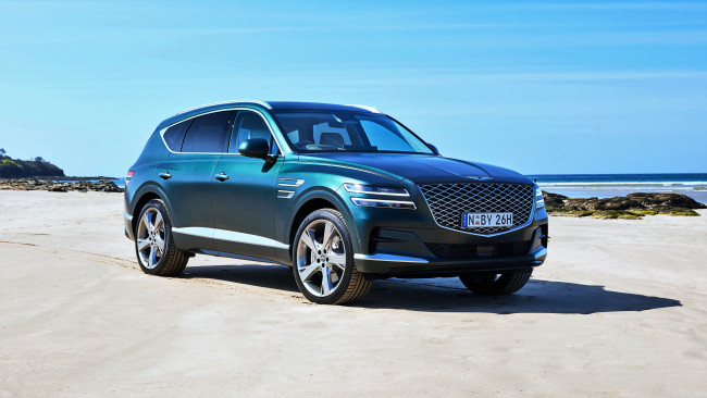 Обои картинки фото автомобили, genesis, синий, берег, камни, море