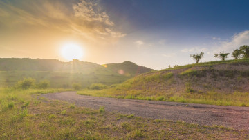 Картинка природа восходы закаты солнце поворот дорога трава холмы лучи