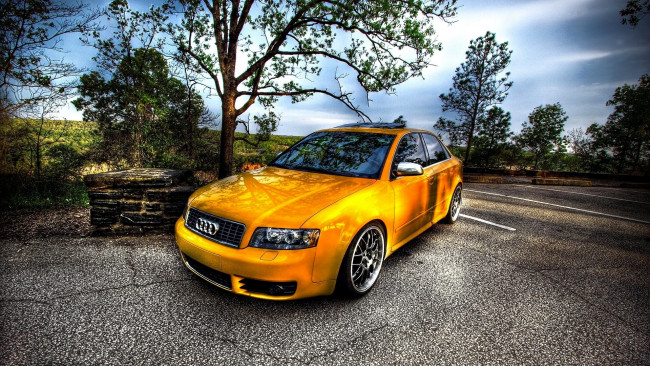 Обои картинки фото автомобили, audi, ауди, желтый, дороги, колодец
