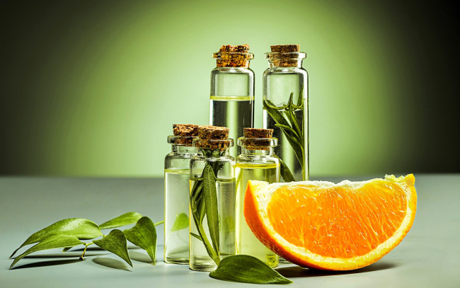 Обои картинки фото разное, косметические средства,  духи, листья, флаконы, апельсин, долька