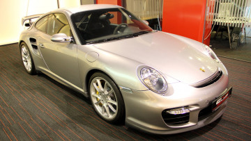 Картинка porsche 911 gt2 автомобили выставки уличные фото элитные спортивные германия