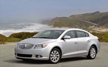 Картинка автомобили buick бьюик серебристый площадка дорога шоссе пейзаж природа горы море